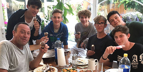 A group of homestay family eating ice cream